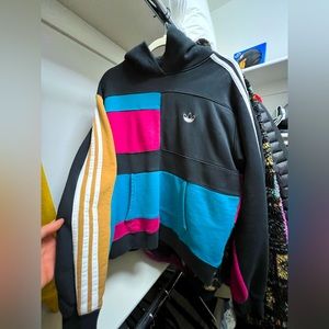 Multicolor Adidas Hoodie that comes in a size Medium.
